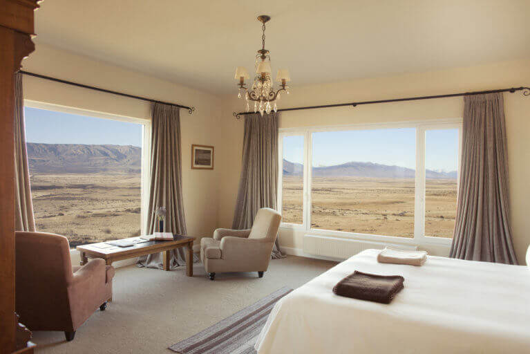Luxury Suite at Eolo Hotel in Patagonia with views of the natural landscape outside