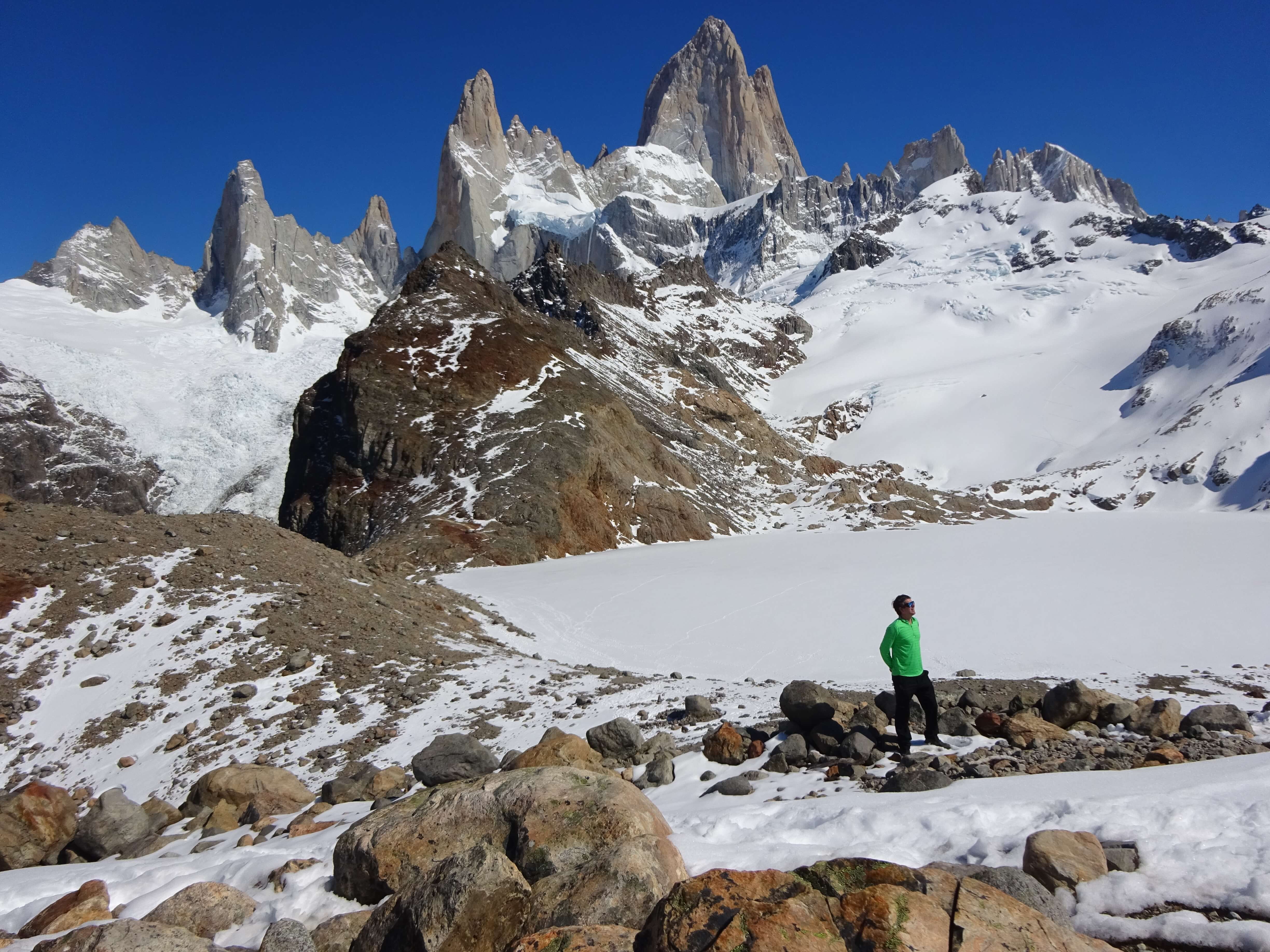 Man trekking up the snowy mountains of Patagonia on a private tour