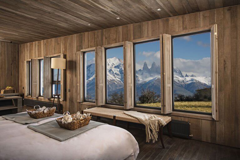Mountain views through the window of a luxury suite at Awasi Hotel in Patagonia