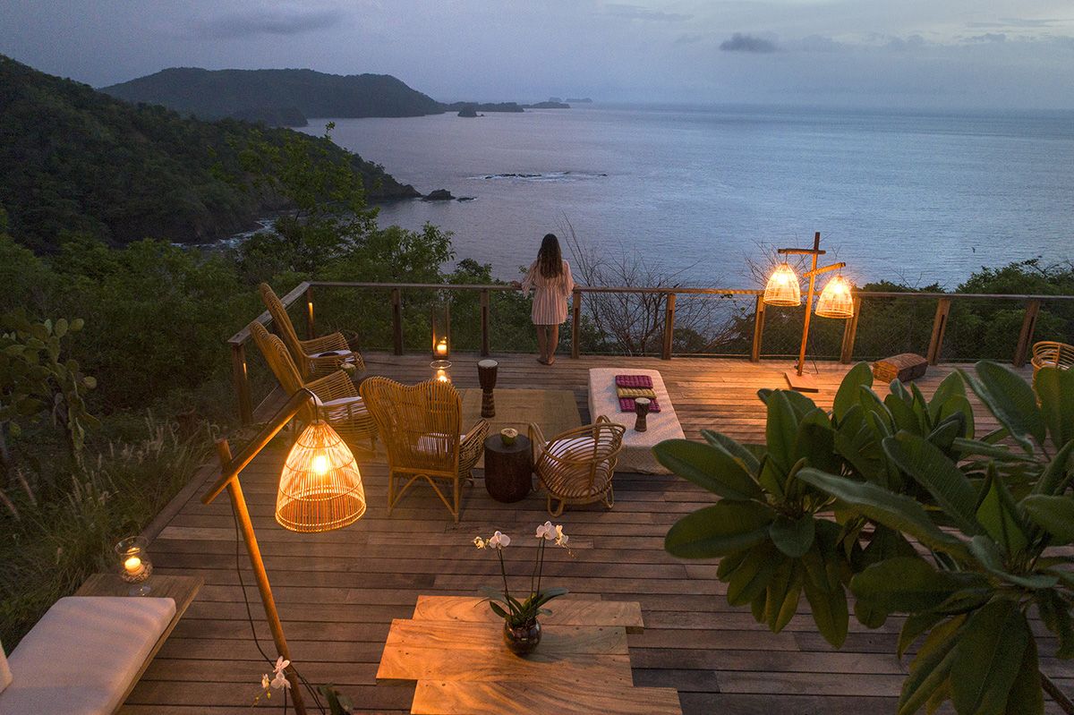Looking out at the beach from a terrace at Lapa Rios Rainforest Lodge at dusk
