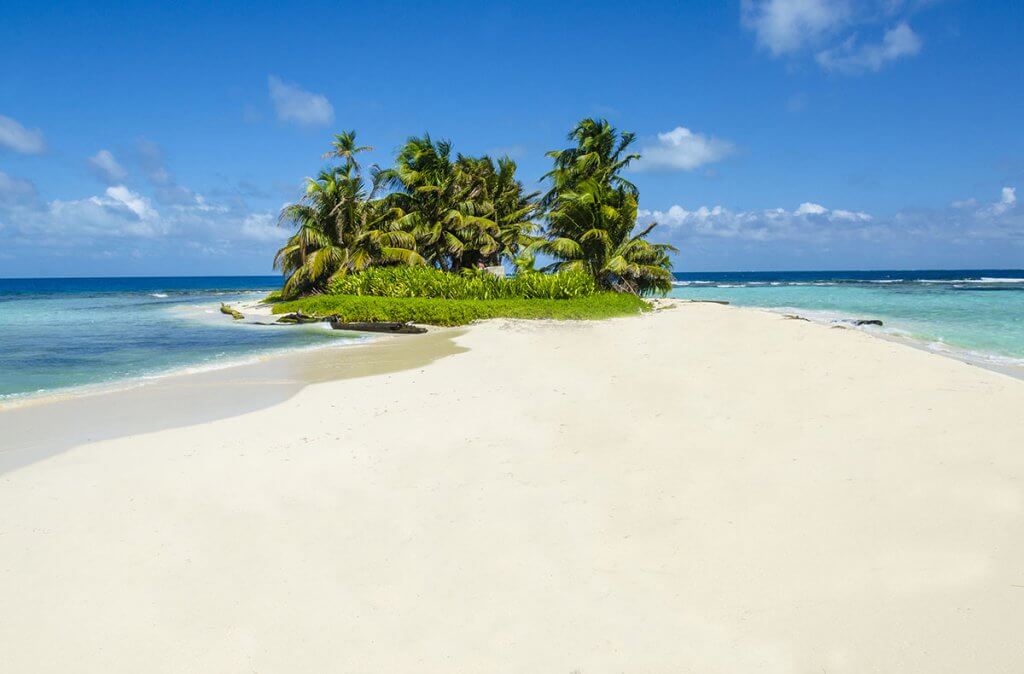Pristine white sand beach on an uninhabited island off the Caribbean coast of Belize