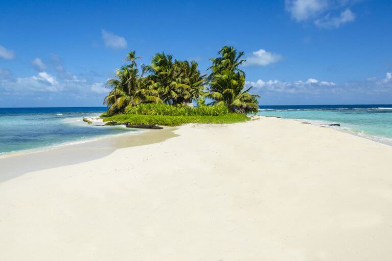 Pristine white sand beach on an uninhabited island off the Caribbean coast of Belize