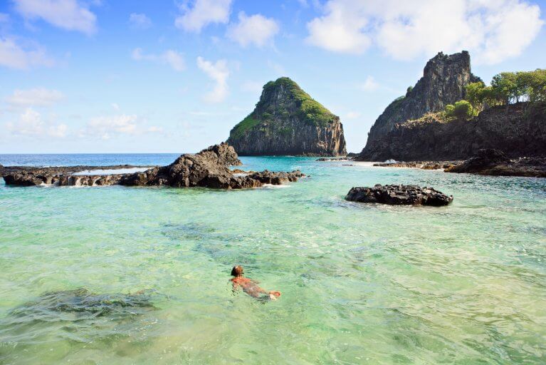 Boy snorkelling in clear waters of Fernando de Noronha during luxury Brazil tour