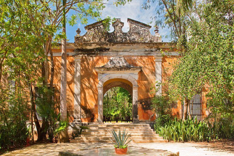Picturesque archway leading to a deluxe suite at the Hacienda Uayamon in Campeche, a stop on a luxury Yucatan tour