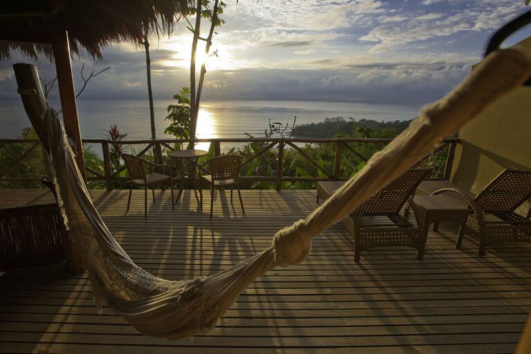Watch the sun go down from a hammock on the terrace at Lapa Rios during a luxury Costa Rica tour
