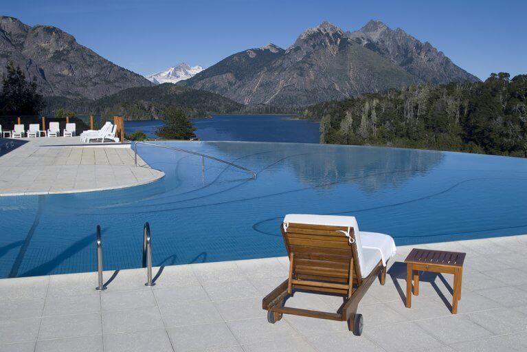 Infinity pool at the Llao Llao Hotel with a lake and mountain view in Bariloche