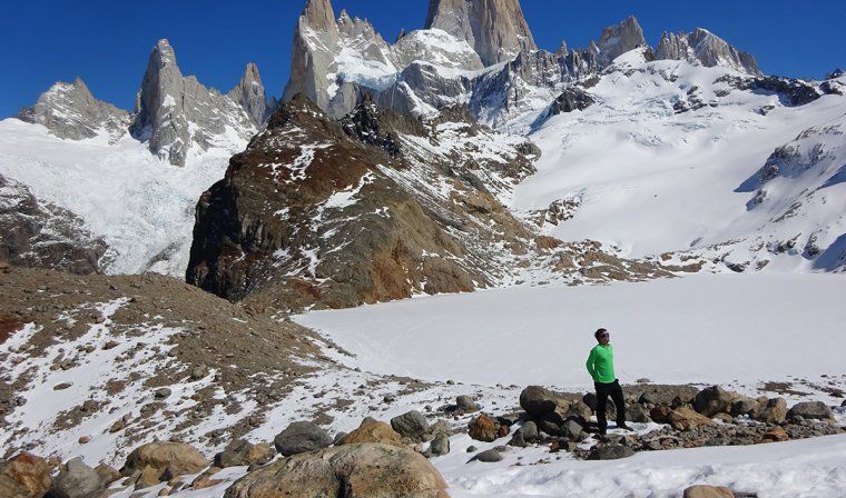 A man pauses while trekking up the snowy Mount Fitz Roy in Argentinian Patagonia