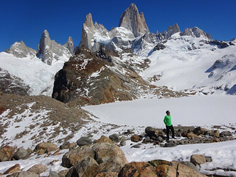 A man pauses while trekking up the snowy Mount Fitz Roy in Argentinian Patagonia