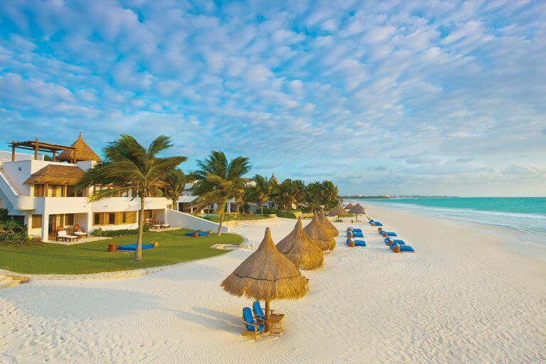 Beach set-up at the Belmond Maroma resort in the Maya Riviera, featuring white sand beaches and turquoise water