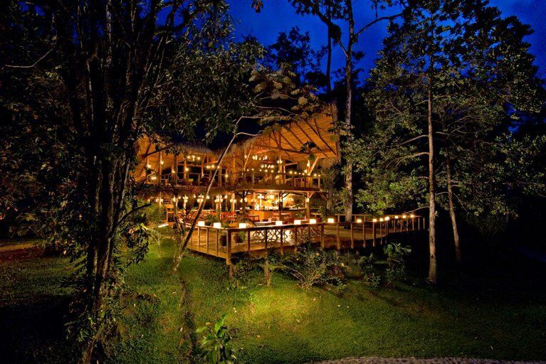 Exterior of Pacuare Lodge at night, a luxury ecolodge in the Costa Rican jungle