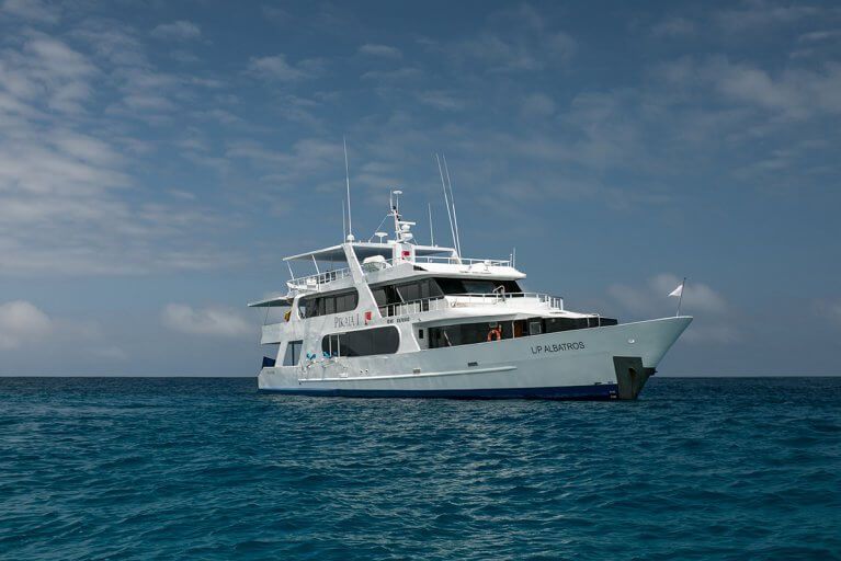 Private yacht from Pikaia Lodge sails on the Pacific Ocean in the Galapagos Islands