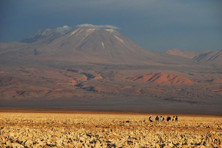 Small group enjoying a private excursion with a guide in the Atacama Desert during a luxury Chile trip