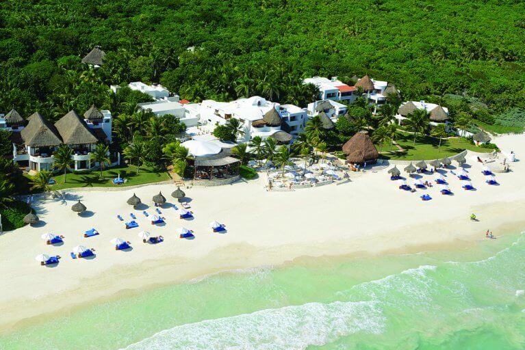 Aerial view of the pristine Caribbean beach at the Belmond Maroma, nestled in the jungle of the Maya Riviera
