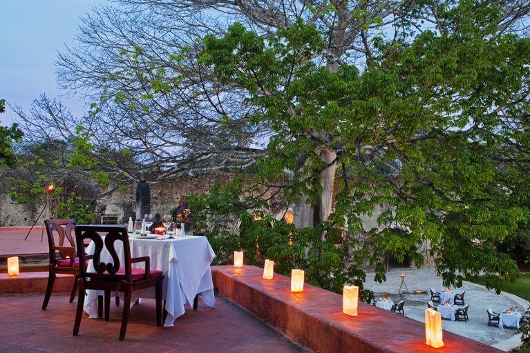 Intimate and romantic dinner set-up at Hacienda Uayamon, a luxury hotel in Campeche during a private tour of the Yucatan peninsula