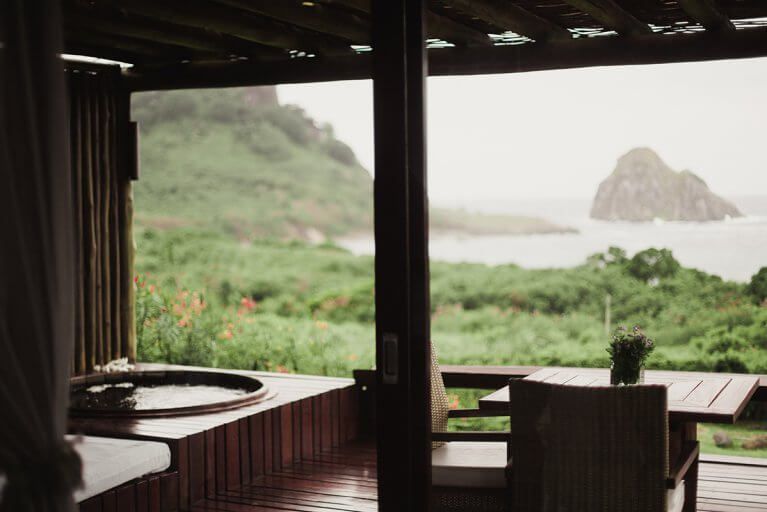 Private terrace with Jacuzzi looking out to ocean and islands from Pousada Maravilha bungalow in Fernando de Noronha