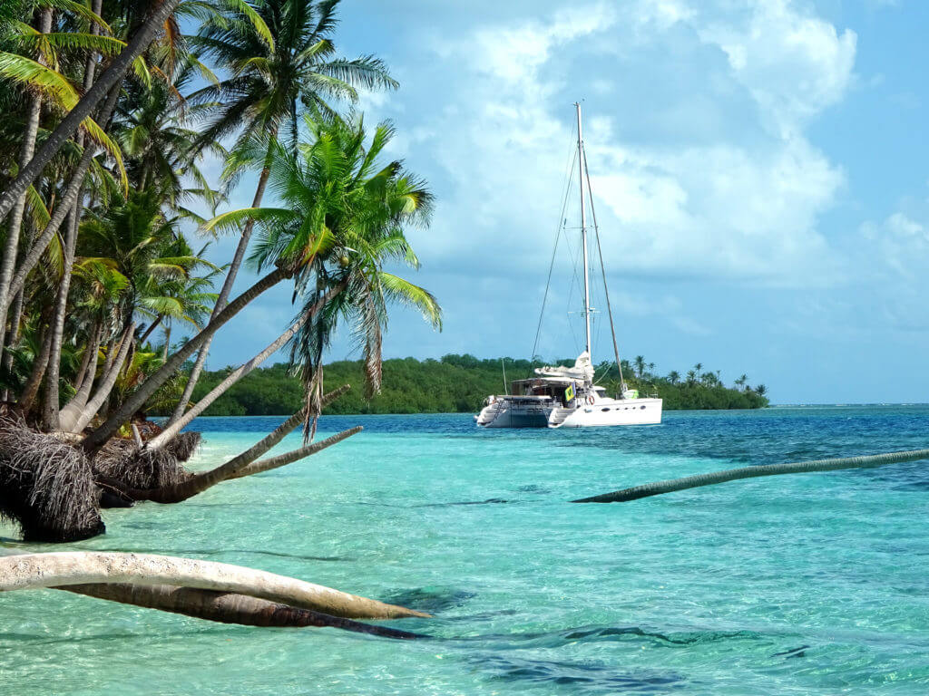 Luxury catamaran and turquoise sea during luxury sailing tour of San Blas Islands in Panama