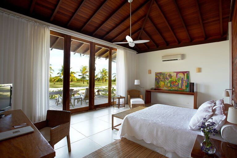 Luxury suite with a private balcony at the Fazenda São Francisco Corumbau Hotel in Bahia, Brazil