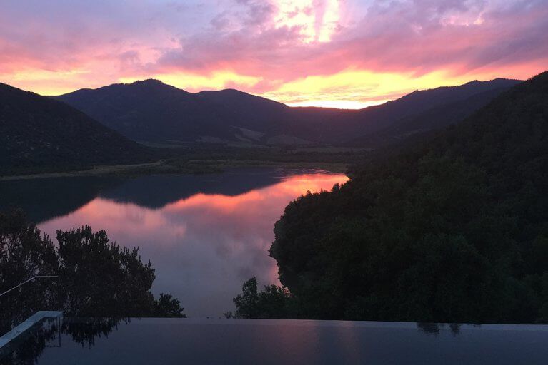 Sunset view of mountains and lakes from outdoor pool at Vik Chile during a private Chile tour