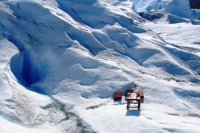 A table set up for a private whiskey tasting on a glacier in Argentinian Patagonia