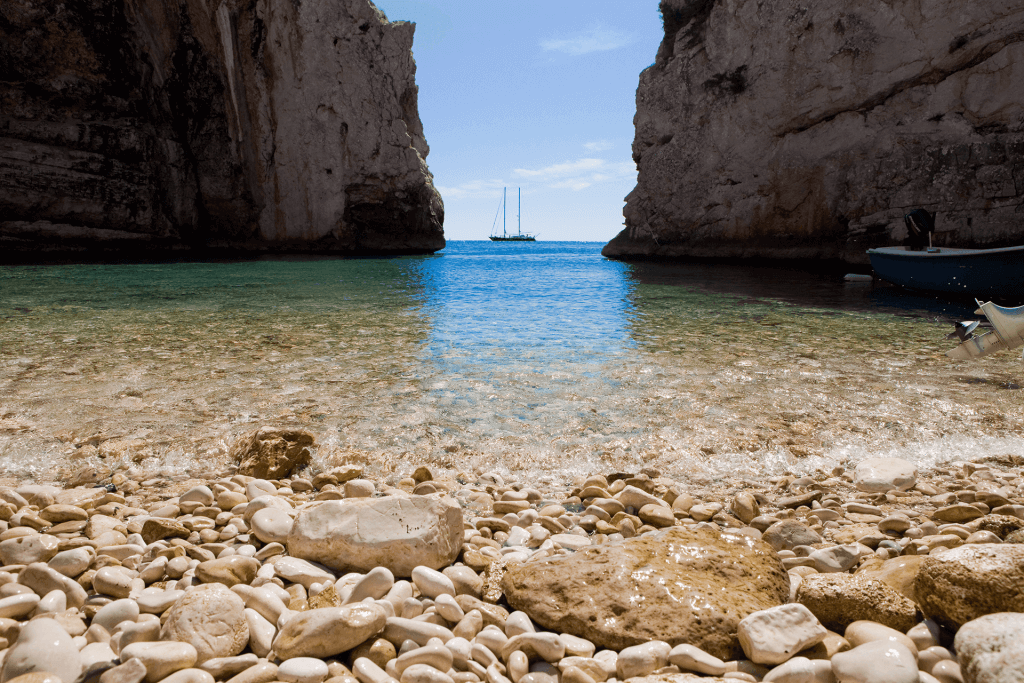 View of boat from Stiniva Beach during luxury Adriatic trip