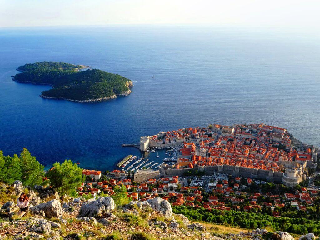 View from hillside above Dubrovnik's Old Town with fortified walls and sea
