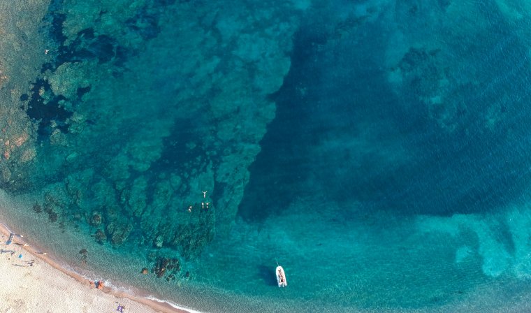 Aerial view of Bonifaco Bay and clear blue sea in Corsica