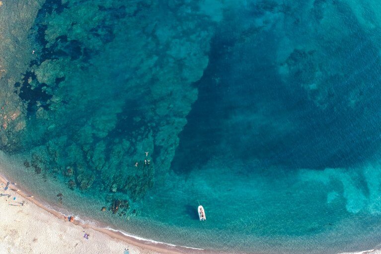 Aerial view of Bonifaco Bay and clear blue sea in Corsica