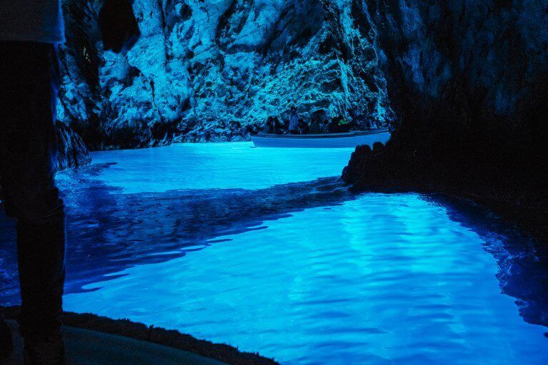 Interior of Blue Cave on Biševo island glowing with blue light during luxury tour of Croatia