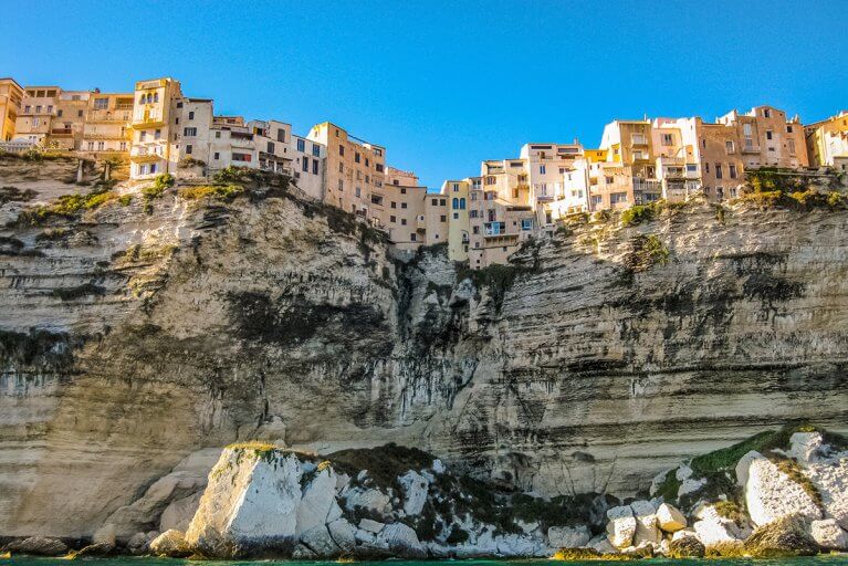 Looking up at town of Bonifacio and cliffs from the sea in Corsica