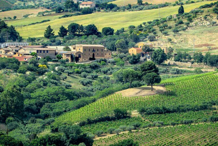 Regaleali Estate and vineyards in the green rolling hills of Silician countryside