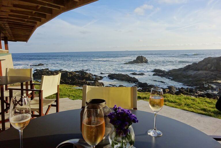 Glasses of champagne at a seaside restaurant in Portugal