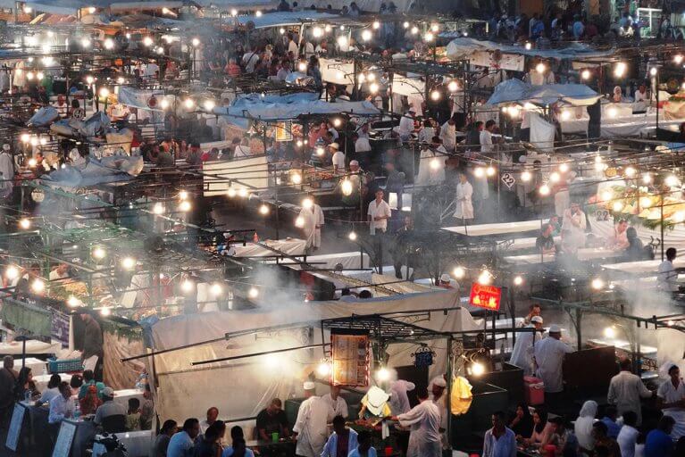 People eating at the street food stalls of Jemaa-el-Fna Square