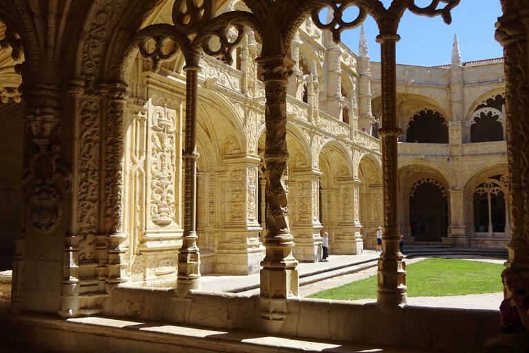 Intricately carved archways in the cloister at the Jeronimos Monastery in Belem, Portugal