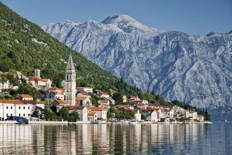Kotor seen from the bay against mountain backdrop during private Adriatic tour