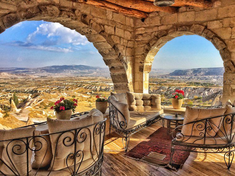 Terrace seating area with view of rocky landscape of Cappadocia at Museum hotel in Turkey