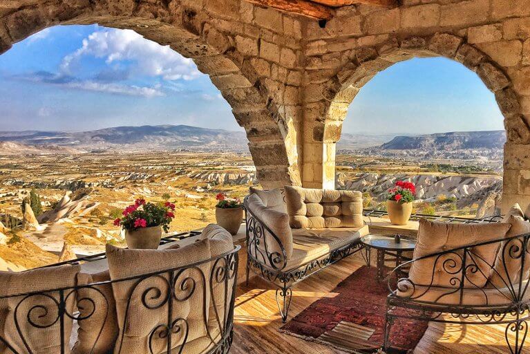 Terrace seating area with view of rocky landscape of Cappadocia at Museum hotel in Turkey