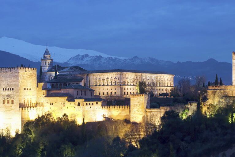 Alhambra lit up at night in Granada, Spain
