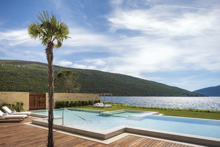 Outdoor pool with sea view at One&Only luxury hotel in Montenegro