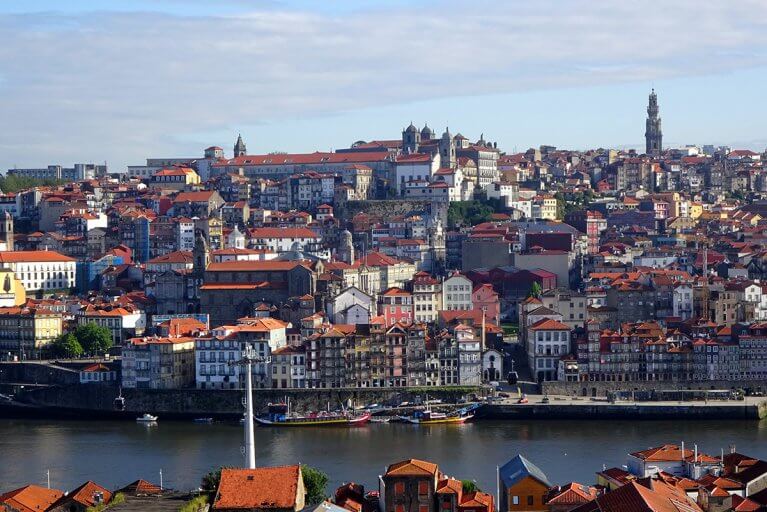 Buildings on a hill by river in Porto, Portugal