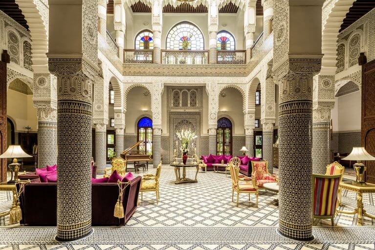 Ornate tiled lobby at Riad Fes luxury hotel in Fes