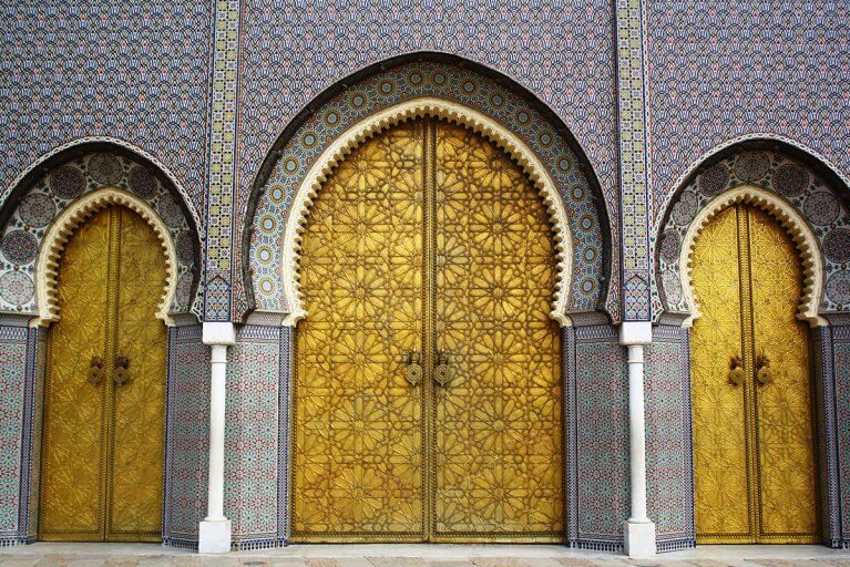 Golden doors and elaborate tilework of the Royal Palace in Fes
