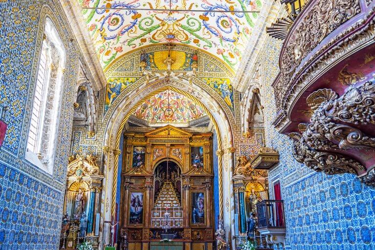 Colorful, intricately painted interior of Sao Miguel Chapel at Coimbra University in Portugal