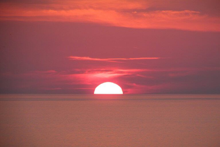 Pink sunset over the water in the Aeolian Islands