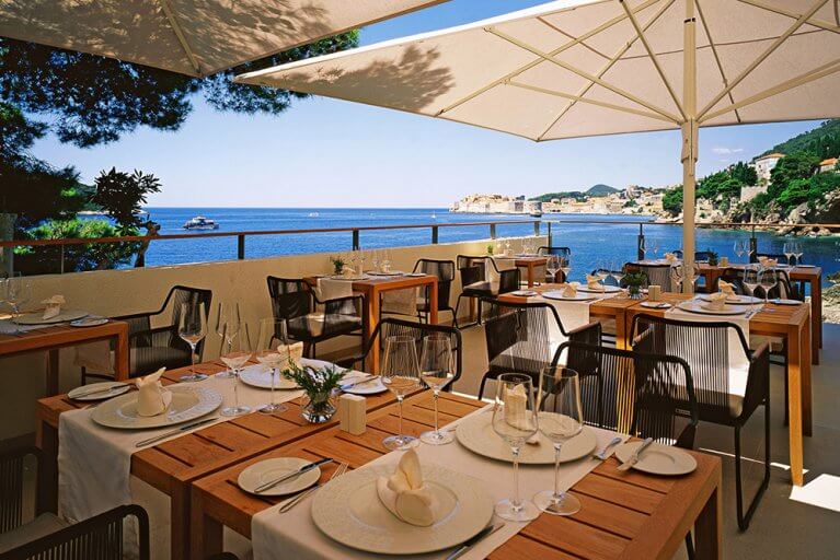 Lunch on shaded patio with sea view at Villa Dubrovnik during luxury Croatia tour