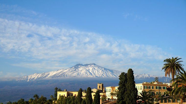 View of Mount Etna from village during private Sicily tour