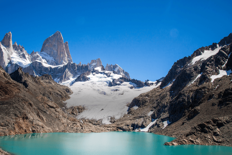 Turquoise glacial lake at the base of the jagged peaks of Mount Fitz Roy