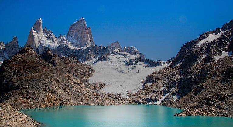 Turquoise glacial lake at the base of the jagged peaks of Mount Fitz Roy