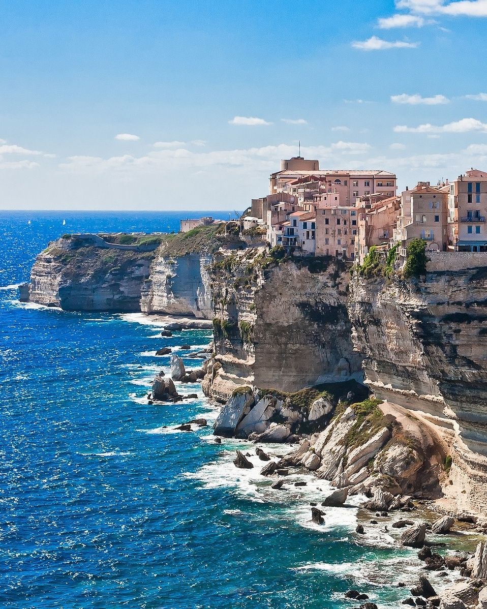 Town of Bonifacio perched on high stone cliffs by the sea in Corsica