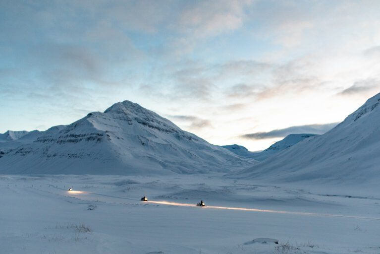 Guests on private snowmobiling adventure during private Iceland vacation