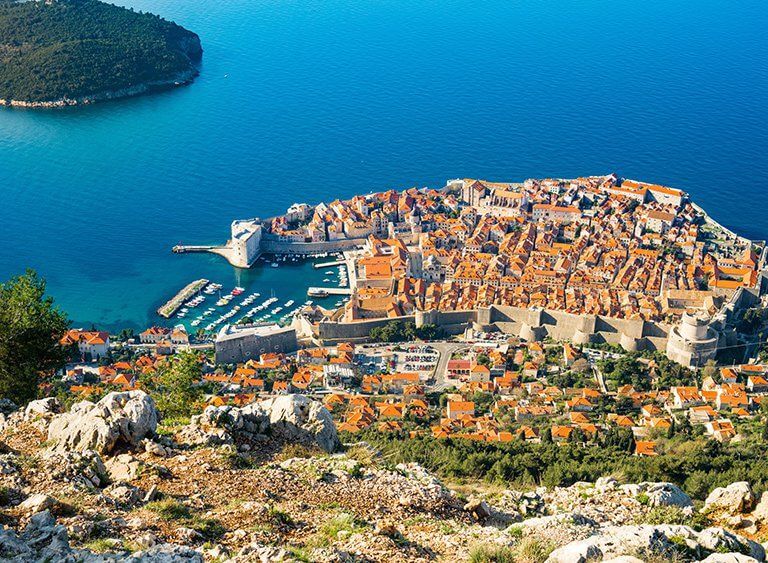 View from above Dubrovnik of Old Town and city walls against the Adriatic sea
